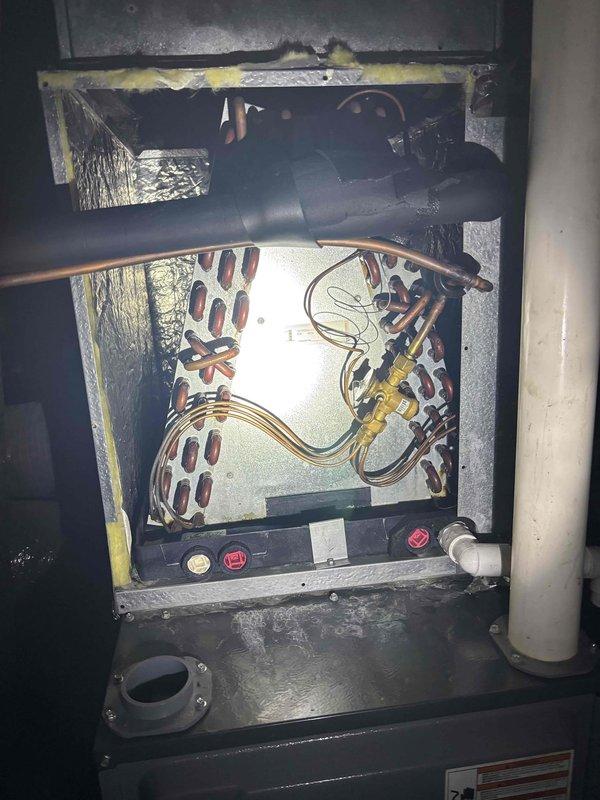 Completed second annual Platinum Level maintenance on 5-year-old HVAC system. Accessed unit interior and inspected evaporator coil assembly, refrigerant lines, and associated copper tubing connections. Verified proper condition of heat exchanger coils and mounting hardware. Checked brass fittings and valves for integrity and proper operation. Utilized digital multimeter to take temperature and electrical measurements, recording readings to verify system performance parameters. Replaced 16x25x5 air filter per maintenance protocol. Inspected insulation material and cabinet seals for deterioration. All components found operating within normal specifications. System is due for annual renewal.
