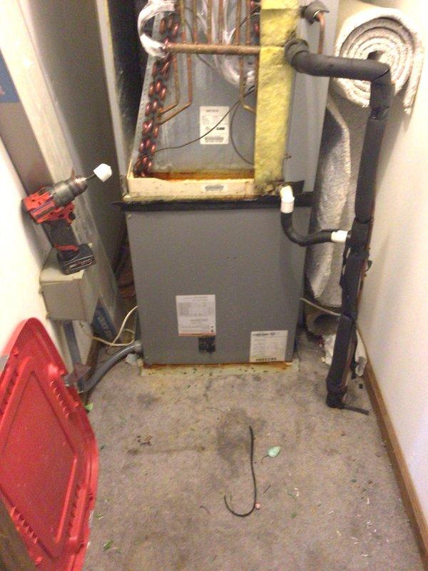 Responded to no-cool service call on 4-year-old system with frozen evaporator coil and minimal airflow. Upon arrival, confirmed air handler had been shut off to allow ice buildup to thaw, with secondary cooling system operational in office area. Inspected outdoor condenser unit positioned against building exterior with adequate clearance, confirmed unit operational with proper electrical connections. Examined indoor air handler and evaporator coil assembly with refrigerant lines and connections intact. System had been running with thermostat set to 74°F while ambient temperature reached 80°F, creating excessive demand. After thaw period completed, verified airflow restoration and proper system operation, checking refrigerant line connections and valve assemblies for leaks or restrictions.