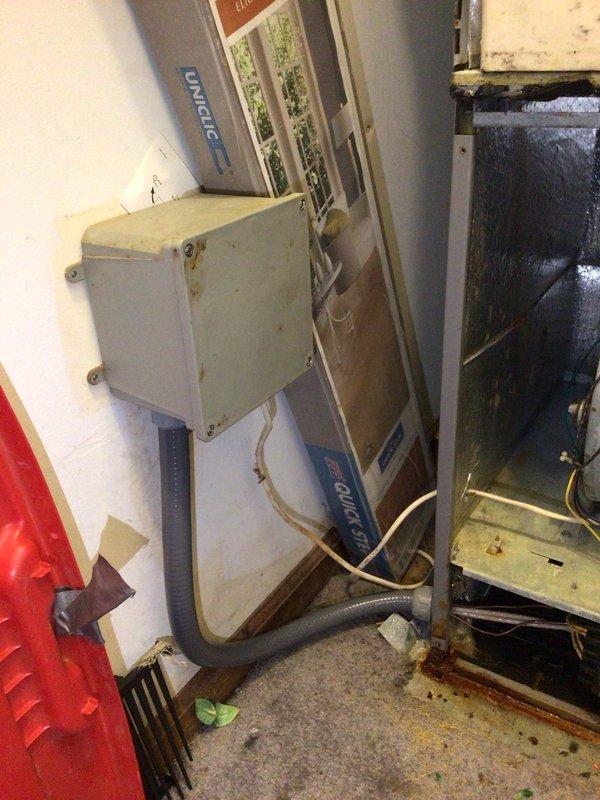 Conducted comprehensive HVAC system assessment for equipment replacement estimate. Evaluated existing Schneider brand split system installation showing signs of age, wear, and floor staining indicating potential condensate drainage issues. Documented current air handler unit with visible dust accumulation and discoloration, along with evaporator coil condition. Photographed equipment specifications, refrigerant line routing, electrical connections, and overall system configuration in confined mechanical room space. Provided detailed documentation and replacement recommendations for upgraded energy-efficient system.