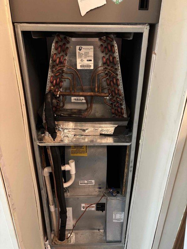 Completed planned maintenance visit on 2-year-old HVAC system with 20x20x5 filter configuration. Performed comprehensive inspection of evaporator coil assembly, air handler unit, and associated components within utility closet installation. Verified proper refrigerant line connections, condensate drain operation via PVC piping, and electrical connections. Measured supply air temperature at 88.1°F at register grille, confirming system operational parameters within normal range. All equipment labels, safety warnings, and documentation verified in place and legible. System operating efficiently with no deficiencies noted during this second maintenance visit.