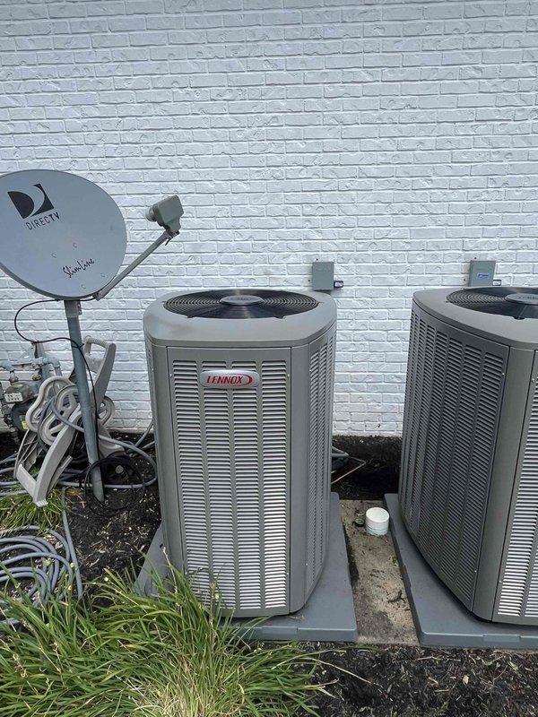 Completed installation of 2-ton, 18 SEER Lennox air conditioning system for upstairs zone. New outdoor condensing unit was installed on concrete pad against exterior wall with proper clearances, electrical connections, and refrigerant line sets. All manufacturer labels, specifications, and QR code identification tags were properly affixed to equipment per code requirements, and system was tested for proper operation.