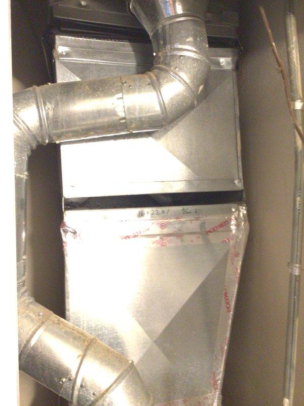 Responded to no cooling complaint with system blowing warm air. Performed diagnostic evaluation of air handler and ductwork system. Verified adequate airflow through supply vents with no ice buildup present on evaporator coil or surrounding components. Inspected thermostat operation and temperature settings for proper functionality.