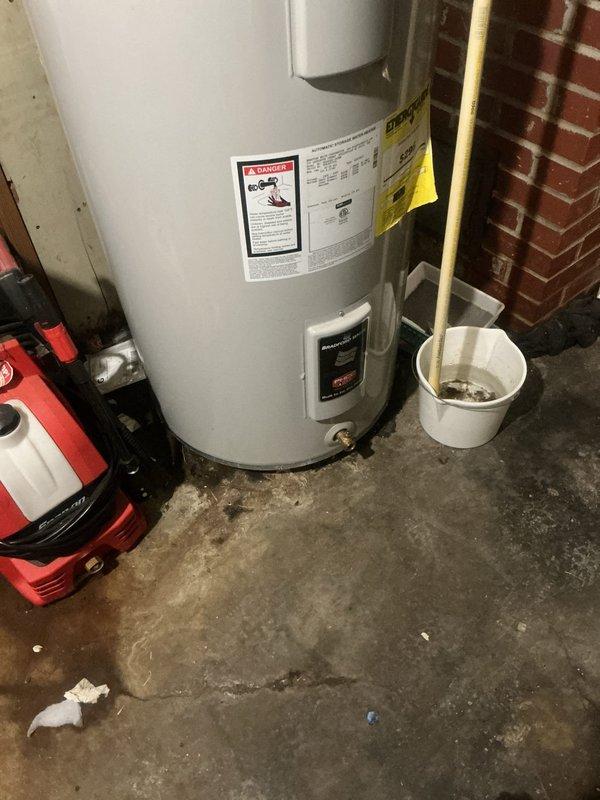 Responded to emergency service call for central air conditioning system reported to be leaking while maintaining cooling operation. Upon arrival, conducted thorough inspection of HVAC system and surrounding utility area. Identified active water leak originating from condensate drainage system. Traced condensate line routing through basement mechanical room and discovered blockage causing overflow condition. Cleared obstruction from condensate drain line and verified proper drainage flow. Inspected evaporator coil drain pan for cracks or deterioration and confirmed structural integrity. Tested system operation under load to ensure condensate removal functioning correctly. Cleaned up standing water from concrete floor using wet vacuum. Monitored system through complete cooling cycle to verify leak resolution and confirm no further water discharge onto floor. System restored to normal operation with proper condensate drainage established.