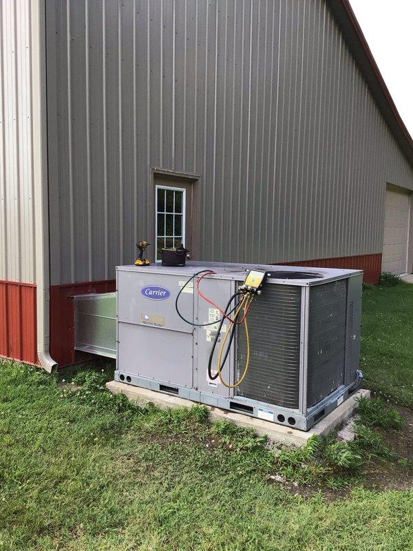 Responded to no cooling complaint on Carrier package unit located at barn structure. Upon arrival, performed complete system diagnostics using manifold gauges to assess refrigerant pressures and system performance. Inspection revealed inadequate cooling capacity and abnormal operating pressures consistent with thermostatic expansion valve (TXV) malfunction. Accessed internal components through service panel to examine refrigerant circuit, including copper lines, service valves, and evaporator coil assembly. Confirmed TXV failure affecting proper refrigerant metering and system efficiency. Documented existing conditions with photographs showing internal components and exterior unit configuration. Provided customer with diagnosis and recommended TXV replacement to restore proper cooling function. Estimated repair time of two hours for parts replacement once component is obtained. System temporarily left in safe operating condition pending parts availability and scheduled repair completio
