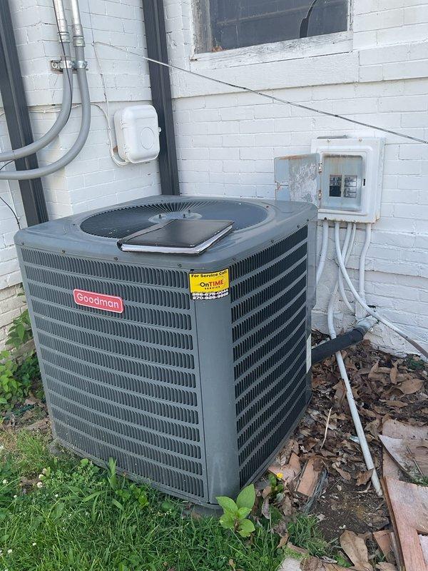 Conducted comprehensive replacement estimate for residential HVAC system with two units on property. Evaluated 15-year-old Goodman air conditioning condenser unit positioned against exterior brick wall with associated electrical disconnect and conduit. Assessed indoor furnace system located in basement area with existing ductwork configuration including insulated horizontal supply ducts and plenum connections. Documented current equipment condition, electrical service connections, and duct infrastructure through detailed site photography. System failure previously confirmed by another contractor prior to visit. Provided replacement options and specifications for outdoor condensing unit and evaluated compatibility with existing indoor air handler and ductwork system. Reviewed installation requirements including electrical service adequacy, refrigerant line routing, condensate drainage, and structural considerations for equipment placement. Estimate focused exclusively on full system rep