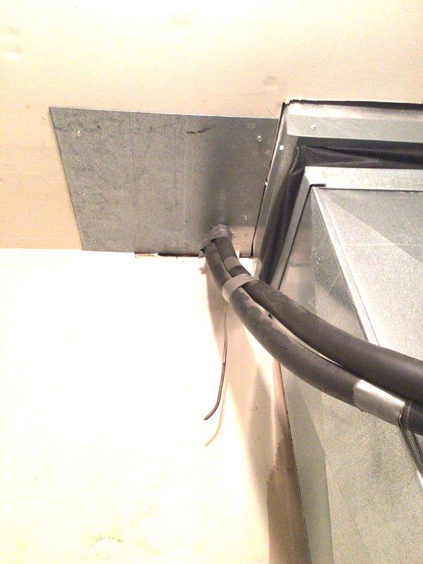 Responded to no-cooling complaint on 12-15 year old geothermal system where thermostat was set to 71°F but indoor temperature had risen to 75°F. Performed diagnostic inspection of air handler, refrigerant lines, and condensate pump system. Inspected insulated refrigerant line connections at air handler unit, ductwork interfaces, and verified condensate pump operation in mechanical closet. System evaluated and findings documented with photographic evidence of equipment condition.