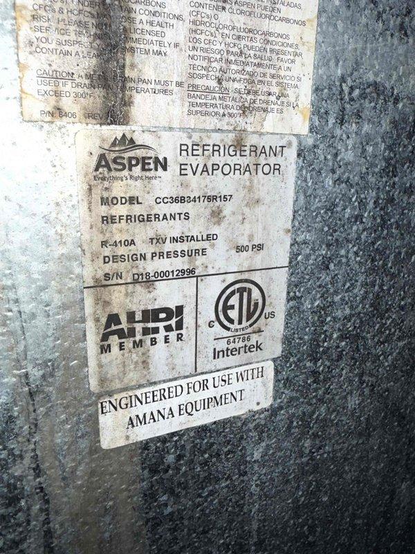 Responded to no-cooling complaint on 8-year-old residential AC system after first seasonal startup. Performed diagnostic inspection of indoor evaporator coil and outdoor condensing unit. Verified system components including Aspen refrigerant evaporator (Model CC36B34175R157) with factory-installed TXV, designed for R-410A refrigerant at 500 PSI. Documented equipment conditions and captured manufacturer data plate information for service records.