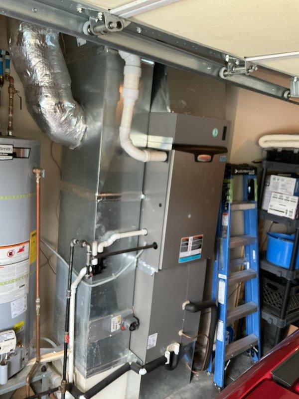# HVAC Maintenance Report

Completed comprehensive annual air conditioning tune-up on a one-year-old residential cooling system. Performed thorough inspection of outdoor condensing unit and indoor air handler located in garage. System found to be operating within normal parameters with no deficiencies noted.

## Work Performed:

**Outdoor Unit Inspection:**
- Inspected condensing unit exterior condition and mounting
- Verified proper clearances around equipment
- Checked refrigerant line insulation integrity
- Examined electrical connections and disconnect
- Cleaned condenser coil and removed debris from unit
- Verified fan motor operation and blade condition

**Indoor Unit Inspection:**
- Inspected air handler cabinet and mounting
- Checked condensate drain line for proper flow
- Examined PVC drain piping and connections
- Verified blower motor operation
- Inspected ductwork connections and sealing
- Checked air filter condition

**System Testing:**
- Measured supply and return air te