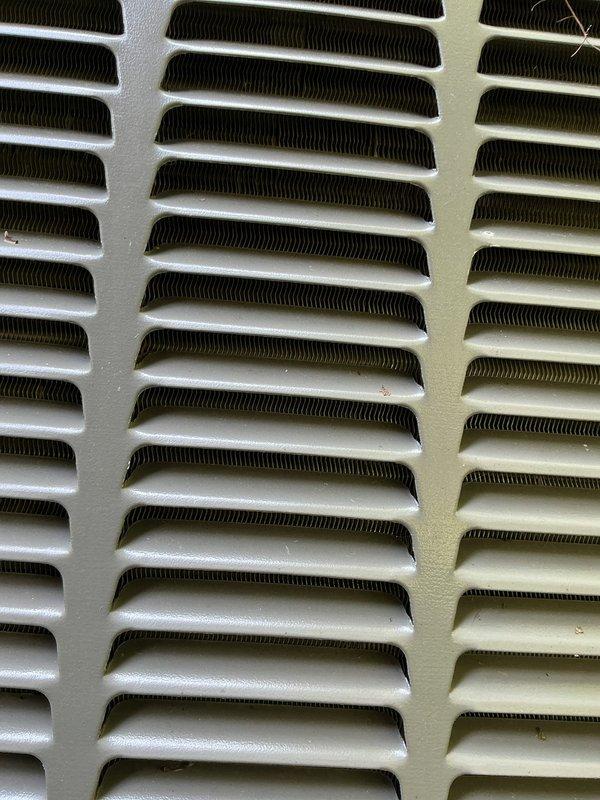 Responded to no-cooling call on 2-year-old residential system with indoor temperature at 82°F and thermostat set to 72°F. Found outdoor condensing unit completely inoperative with no power to compressor or condenser fan. Performed diagnostic testing on electrical components, checked capacitor values, tested contactor operation, and verified proper voltage at disconnect. Inspected condenser coil condition and cleared vegetation growth around unit perimeter to ensure adequate airflow clearance. Restored system to full operational status with outdoor unit running properly and cooling cycle engaged.