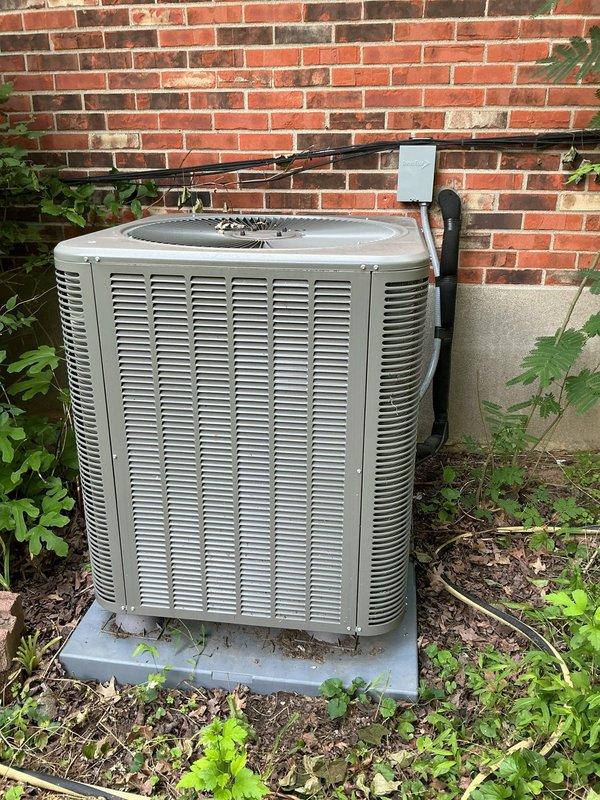 Responded to no-cooling call on 2-year-old residential system with indoor temperature at 82°F and thermostat set to 72°F. Found outdoor condensing unit completely inoperative with no power to compressor or condenser fan. Performed diagnostic testing on electrical components, checked capacitor values, tested contactor operation, and verified proper voltage at disconnect. Inspected condenser coil condition and cleared vegetation growth around unit perimeter to ensure adequate airflow clearance. Restored system to full operational status with outdoor unit running properly and cooling cycle engaged.