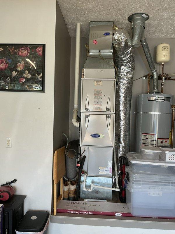 Completed scheduled air conditioning tune-up and maintenance on residential Carrier HVAC system. Performed comprehensive inspection of indoor air handler unit and outdoor condenser unit, verified all mechanical and electrical components operating within manufacturer specifications, and documented system condition with photographic records for maintenance history.