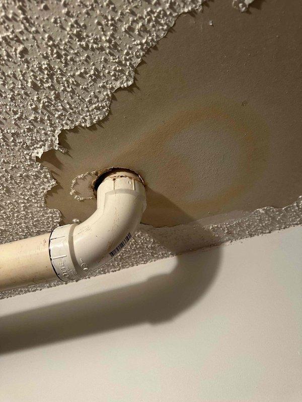 Completed installation of 2.5-ton, 15.5 SEER air conditioning system with 97% AFUE gas furnace as a complete HVAC system replacement. Installed new condensate drain lines with PVC piping routed through ceiling penetrations; ceiling texture damage observed around pipe penetrations will require customer attention for cosmetic repair. System tested and operational, with all components functioning to manufacturer specifications.