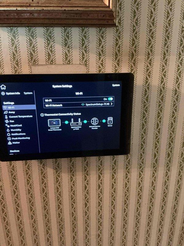Responded to follow-up service call for 3-ton 19 SEER heat pump and air handler system experiencing temperature control issue where thermostat set to 74°F but home temperature reading 75°F. Inspected smart thermostat settings and connectivity, verified Wi-Fi connection to SpectrumSetup-TC26 network, and reviewed system configuration including Fault Line™ feature and temperature calibration settings. Documented thermostat interface and connectivity status, coordinated with customer to schedule return appointment for further diagnosis and temperature differential correction.