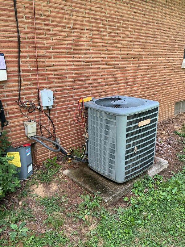 Responded to no-cooling call on 19-year-old residential HVAC system with frozen evaporator coil. Upon arrival, unit was shut down with indoor temperature at 79°F. Conducted diagnostic evaluation of outdoor condenser unit and attic-mounted air handler to identify cause of coil freeze-up. Inspected refrigerant lines, airflow components, and electrical connections on aging equipment. Documented system condition with photographic evidence showing outdoor condenser unit mounted on concrete pad with associated electrical disconnect and indoor air handler with visible wear and dust accumulation. Advised homeowner on findings related to system age and performance issues affecting cooling capacity.