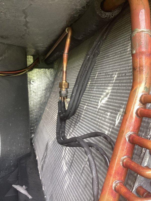 Responded to no cooling complaint on 3-year-old system blowing room temperature air. Connected refrigerant manifold gauges to service ports and performed system diagnostics. Measured suction and discharge pressures along with temperature readings at evaporator coil. Inspected condenser coil fins, refrigerant lines, and copper piping connections for proper operation. System showed adequate airflow through vents with no ice buildup present. Evaluated heat exchanger assembly and verified refrigerant line insulation integrity. Documented pressure and temperature differentials across the system to determine root cause of cooling loss and provided recommendations for necessary repairs to restore proper cooling function.