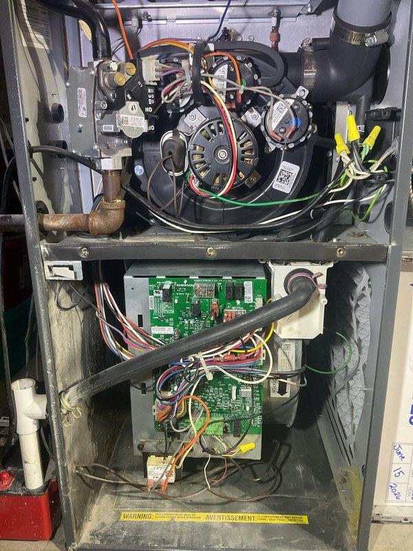Completed annual planned maintenance visit on 8-year-old residential HVAC system. Performed comprehensive inspection of furnace unit with all access panels removed to evaluate internal components, electrical connections, and control systems. Inspected blower motor assembly, gas valve mechanisms, and associated brass fittings for proper operation. Evaluated circuit boards and control modules for signs of wear or malfunction. Examined all wiring harnesses, electrical connections, and safety switches throughout upper and lower compartments. Checked PVC condensate drainage and venting lines, copper refrigerant lines, and flexible electrical conduit connections. Assessed overall system condition including minor dust accumulation on internal components. Verified 16x25x5 filter size for future maintenance requirements. Documented system condition through photographic records showing internal components, electrical systems, and installation configuration. Unit operating within normal parameter