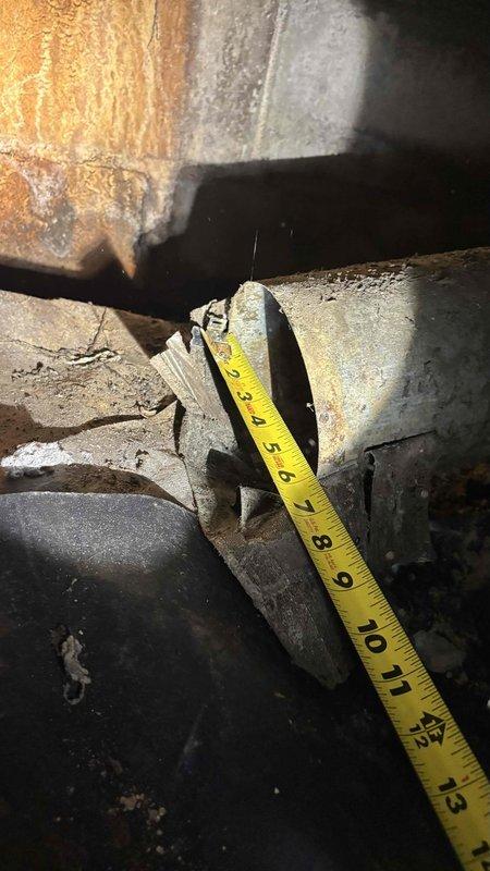 Conducted thorough inspection and evaluation of original 1974 crawl space ductwork system showing extensive age-related deterioration. Found significant structural damage including cracking, splitting, and material separation in main supply ducts, with visible staining and compromised integrity throughout the duct runs. Documented all findings with detailed photography for estimate preparation to replace the 52-year-old ductwork system.