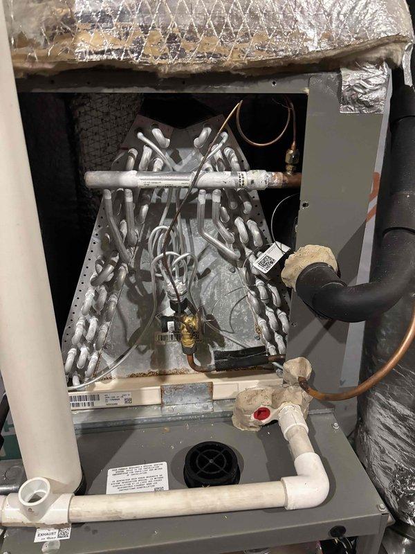Completed second Platinum Level planned maintenance visit on dual-system HVAC installation, both units approximately 2 years old. Performed comprehensive inspection and servicing of both systems, including filter replacement with 20x25x5 filter for downstairs unit and 16x25x5 filter for upstairs unit. Inspected evaporator coil assembly on indoor air handler, noting significant dust and debris accumulation on aluminum fins requiring attention. Checked refrigerant lines, condensate drain system with PVC piping, and verified proper operation of drain pan and connections. Examined outdoor condenser unit electrical components, including capacitor, contactors, and associated wiring connections. All electrical connections inspected and found secure with proper wire routing. Verified system operation and completed routine maintenance procedures per Platinum Level service protocol.