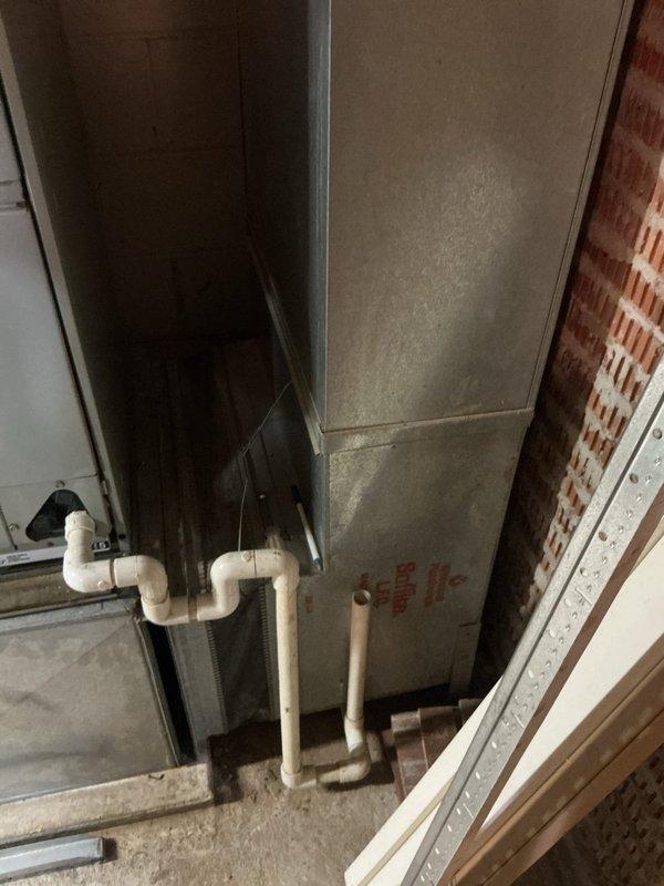 Responded to no cooling complaint on 20-year-old residential air conditioning system. Upon arrival, confirmed airflow present at registers but no cold air being delivered. Performed diagnostic evaluation of outdoor condensing unit and indoor air handler. Inspected refrigerant lines, electrical connections, and condensate drainage system in mechanical room. Evaluated condenser unit positioned in side yard on concrete pad with proper clearances. System showed signs of age-related wear and component degradation consistent with equipment at end of service life. Provided customer with findings and recommended options for repair versus replacement given the advanced age of the equipment.