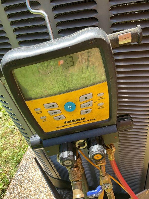 Completed scheduled air conditioning tune-up and preventive maintenance on residential cooling system. Performed comprehensive system diagnostics using refrigerant manifold gauges to verify proper refrigerant pressures and temperatures, ensuring optimal operating conditions. Confirmed thermostat functionality with system responding appropriately to temperature setpoint of 73 degrees in cooling mode.