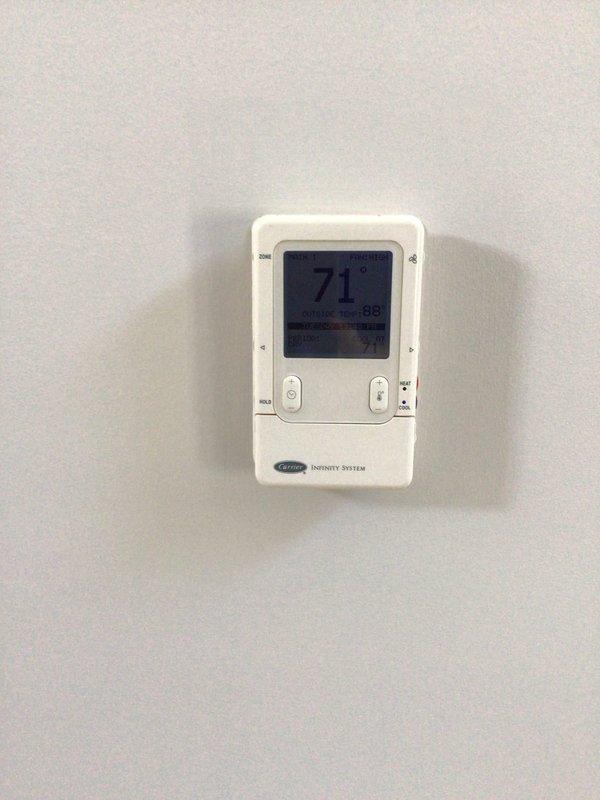 Responded to water leak issue in basement affecting 14-year-old Carrier Infinity system. Inspected air handler unit and condensate pump assembly where pooling water was observed at equipment base. Documented system conditions and leak source for home inspection requirements, photographed thermostat settings and HVAC equipment configuration, and advised property owner of findings for pre-sale disclosure purposes.