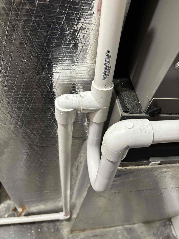 Completed routine planned maintenance and tune-up on two recently installed air conditioning units. Performed comprehensive system inspection, verified thermostat operation showing cooling mode set to 71 degrees with current temperature at 74 degrees, and inspected condensate drain piping configuration. Both units operating within normal parameters with no deficiencies noted.