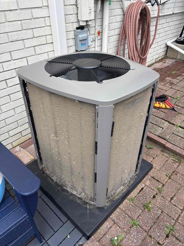 Completed annual first-visit planned maintenance on a 3-year-old single-system HVAC unit. Performed comprehensive inspection of indoor air handler compartment, examining copper refrigerant lines, coiled tubing, and connection points for proper operation and integrity. Replaced 16x25x5 air filter and inspected outdoor condenser unit positioned on exterior pad, verifying fan operation and coil condition. All components found operating within normal parameters with no immediate service needs identified.