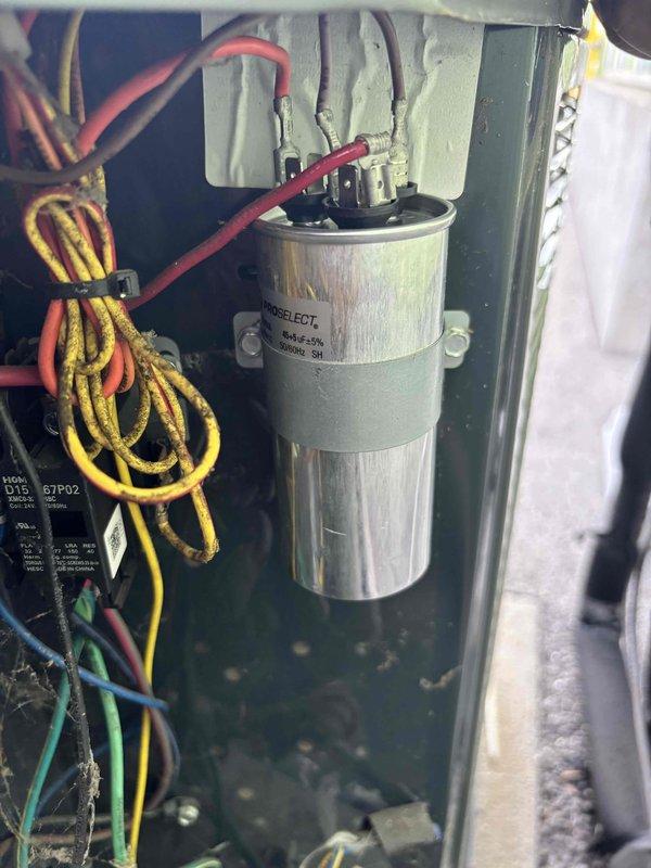 Responded to a no-cooling complaint for multiple HVAC units at a commercial property with systems approximately 10-15 years old. Performed diagnostic evaluation on two to three units servicing office and main building areas that were not maintaining adequate temperature. Conducted comprehensive system assessment including electrical component inspection and refrigerant system analysis. Utilized digital manifold gauges to measure system pressures and temperatures across multiple points, recording superheat and subcooling values to determine system performance. Inspected electrical panel components including capacitor, contactor, and associated wiring for proper operation and connections. All units showed airflow at vents with no ice buildup present at time of service. Documented system conditions with detailed photographs of electrical components and diagnostic readings for service records.