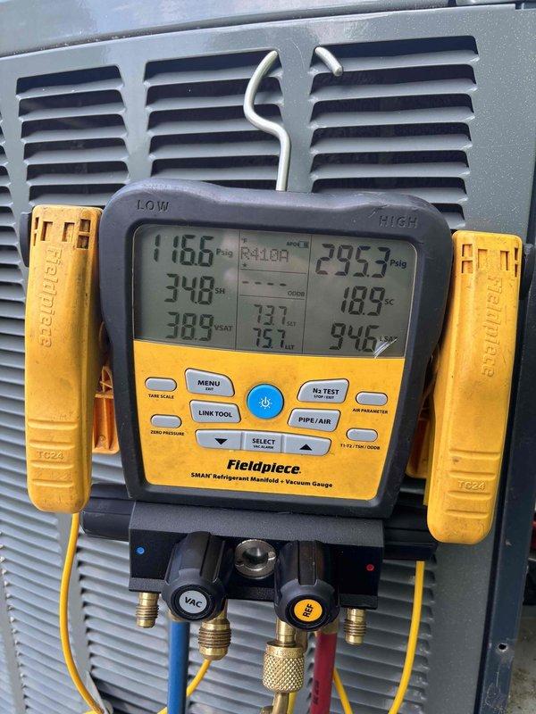 Responded to a no-cooling complaint for multiple HVAC units at a commercial property with systems approximately 10-15 years old. Performed diagnostic evaluation on two to three units servicing office and main building areas that were not maintaining adequate temperature. Conducted comprehensive system assessment including electrical component inspection and refrigerant system analysis. Utilized digital manifold gauges to measure system pressures and temperatures across multiple points, recording superheat and subcooling values to determine system performance. Inspected electrical panel components including capacitor, contactor, and associated wiring for proper operation and connections. All units showed airflow at vents with no ice buildup present at time of service. Documented system conditions with detailed photographs of electrical components and diagnostic readings for service records.