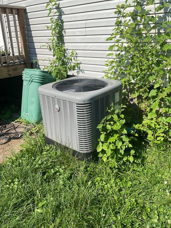 Conducted comprehensive HVAC system replacement estimate for residential property with existing outdoor condenser unit and downflow furnace configuration. Evaluated current system performance, documented equipment specifications including 52.5" furnace with evaporator coil assembly, assessed installation conditions including base structure integrity, and photographed existing outdoor unit placement adjacent to home exterior. Provided homeowner with complete replacement options for non-functioning system requiring full equipment upgrade.