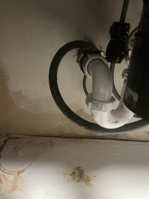 Successfully completed kitchen sink plumbing installation including repiping the drain line from the sink to the garbage disposal unit with new white PVC trap assembly and connections. Additionally performed drain line snaking service to clear the kitchen sink drain and restore proper water flow.