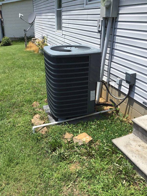 Completed planned maintenance visit on a 6-year-old single-system HVAC unit as part of annual service agreement. Inspected and verified operation of Honeywell thermostat displaying proper temperature reading, examined outdoor condensing unit with cylindrical configuration and confirmed adequate clearance from building structure, and documented system condition through photographic records. Unit operational and ready for continued service with renewal recommendation for ongoing maintenance coverage.
