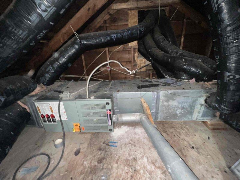 Completed comprehensive replacement estimate for attic-mounted HVAC system with non-functional air conditioning unit. Assessed existing horizontal furnace and air handler configuration, documented ductwork layout including flexible duct runs and metal supply trunk, measured equipment dimensions and clearances for Rheem system replacement specification. Provided detailed equipment replacement proposal addressing failed cooling system while preserving operational heating components.