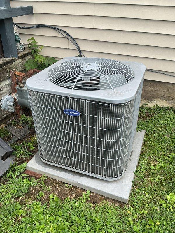 Responded to service call for grinding noise from basement Carrier HVAC system during shutdown cycle. Inspected 10-year-old furnace/air handler unit and outdoor condenser. Performed diagnostic evaluation of blower motor, inducer assembly, and system components during operation and shutdown sequences. Unit maintained adequate heating/cooling capacity throughout inspection. Documented equipment condition with interior furnace compartment and exterior condenser photographs showing standard wear patterns consistent with system age. Vegetation growth noted around outdoor unit requiring clearance maintenance for optimal airflow.