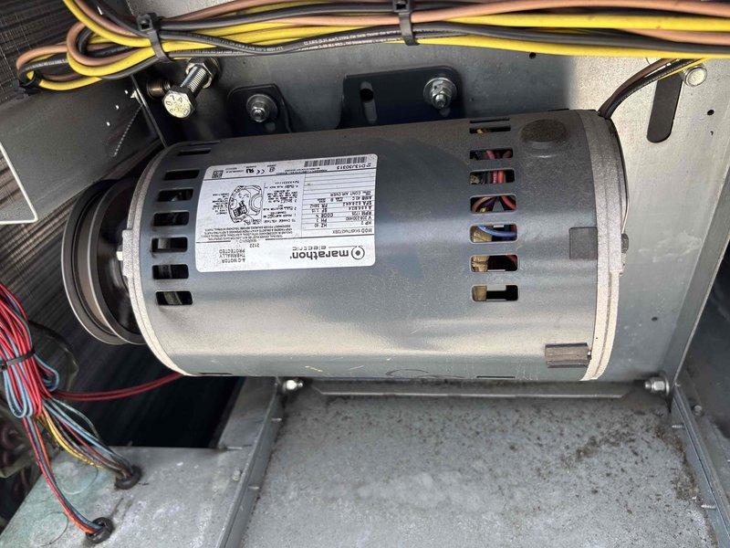 Responded to no cooling complaint on 9-year-old rooftop AC system. Diagnosed failed control board on initial visit, returned with replacement board and installed. Second callback required for failed condenser fan motor. Replaced Marathon condenser fan motor, verified proper electrical connections, and restored system to full cooling operation. Unit tested and operational upon completion.