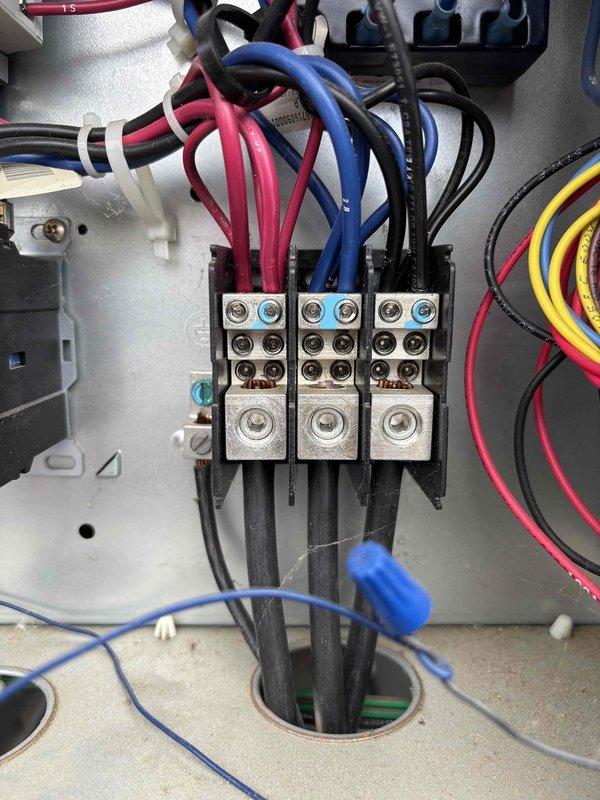 Completed follow-up visit to address previously deferred maintenance items. Installed replacement belts on HVAC equipment as discussed with on-site contact. Conducted comprehensive equipment inventory survey of all units on property to prepare maintenance package proposal, documenting make, model, and specifications of multiple systems. Inspected electrical contactors and control wiring in unit control panels, photographed components for service records showing proper connections and system configuration.