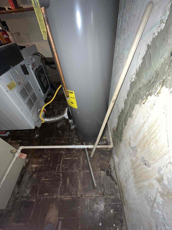 Conducted comprehensive replacement estimate for existing HVAC system in basement mechanical room. Evaluated current Arcoaire furnace unit and white air handler installation, assessed ductwork configuration including rigid supply ducts extending from furnace to ceiling joists, and documented existing equipment specifications. Photographed equipment layout, utility room conditions, electrical connections, gas line routing, and spatial constraints for replacement planning, providing homeowner with complete system replacement options and recommendations.