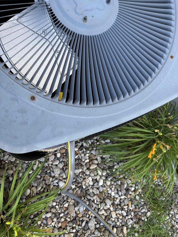 Completed planned maintenance visit on residential single-system HVAC unit with focus on cooling system components. Performed comprehensive inspection of outdoor condenser unit, verified proper operation of fan assembly and compressor, checked refrigerant levels, and cleaned condenser coils. Inspected thermostat operation showing system set to 72°F in cooling mode with auto fan setting, confirmed accurate temperature readings and proper communication between thermostat and equipment. Documented system condition with photos showing outdoor unit in good operational condition with no visible damage or wear, proper drainage around gravel pad, and secure electrical connections. All cooling system components functioning within normal parameters for 4-year-old equipment using 16x25x1 filter size.