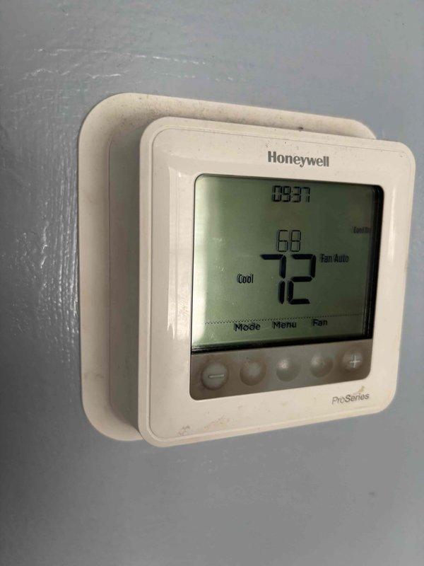 Completed planned maintenance visit on residential single-system HVAC unit with focus on cooling system components. Performed comprehensive inspection of outdoor condenser unit, verified proper operation of fan assembly and compressor, checked refrigerant levels, and cleaned condenser coils. Inspected thermostat operation showing system set to 72°F in cooling mode with auto fan setting, confirmed accurate temperature readings and proper communication between thermostat and equipment. Documented system condition with photos showing outdoor unit in good operational condition with no visible damage or wear, proper drainage around gravel pad, and secure electrical connections. All cooling system components functioning within normal parameters for 4-year-old equipment using 16x25x1 filter size.