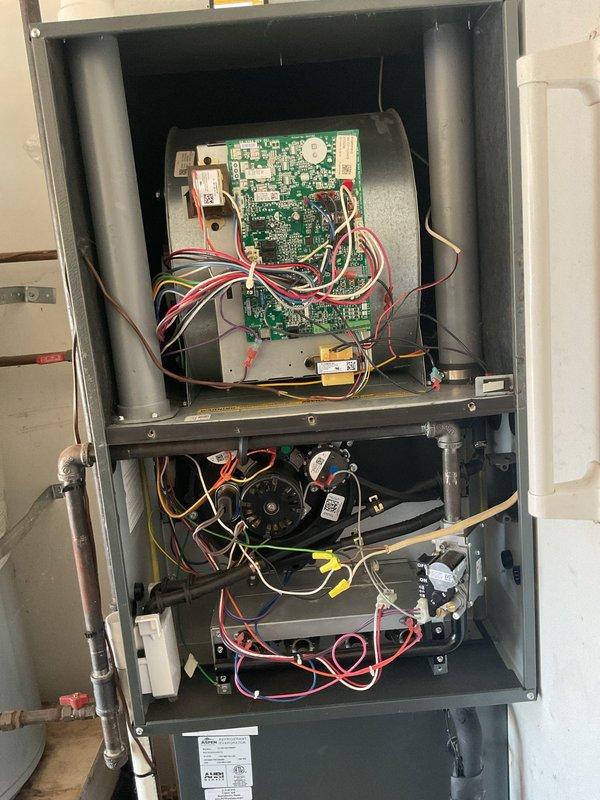 Completed annual platinum-level maintenance on 4-year-old HVAC system during second scheduled visit. Replaced 20x20x2 polarized air filter, inspected and photographed gas furnace control valve and water heater components showing proper operation of automatic safety stop mechanisms. Accessed air handler unit, verified control board functionality with all electrical connections secure, and confirmed blower motor assembly operating within specifications with no unusual wear or performance issues detected.
