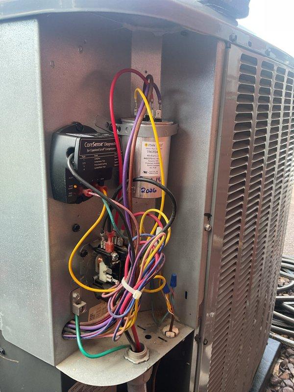 Completed scheduled AC tune-up maintenance on residential HVAC system. Performed comprehensive inspection of outdoor condensing unit, verifying proper operation of CoreSense control module and TITAN capacitor dated 2020. Inspected indoor air handler unit, confirmed 16x25x4 Filtrete air filter with service date marked January 2026, and verified all electrical connections, circuit boards, blower assembly, and refrigerant line components were functioning properly with no issues identified.