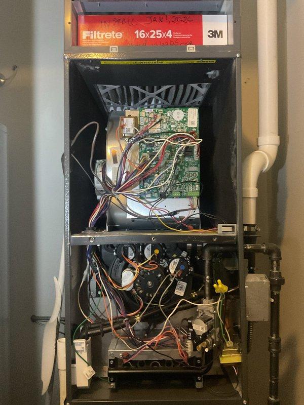 Completed scheduled AC tune-up maintenance on residential HVAC system. Performed comprehensive inspection of outdoor condensing unit, verifying proper operation of CoreSense control module and TITAN capacitor dated 2020. Inspected indoor air handler unit, confirmed 16x25x4 Filtrete air filter with service date marked January 2026, and verified all electrical connections, circuit boards, blower assembly, and refrigerant line components were functioning properly with no issues identified.
