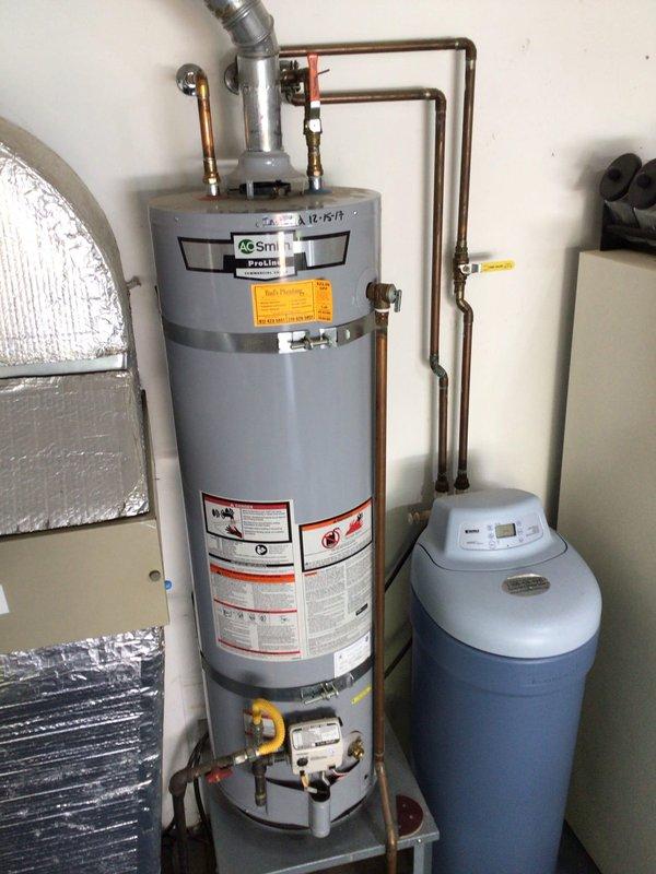 Completed scheduled air conditioning tune-up and preventative maintenance as part of planned HVAC maintenance campaign. Performed comprehensive system inspection, verified proper operation of cooling equipment, and documented installation including water heater and water softener system present in utility area. All AC components checked and system confirmed operational for continued service.
