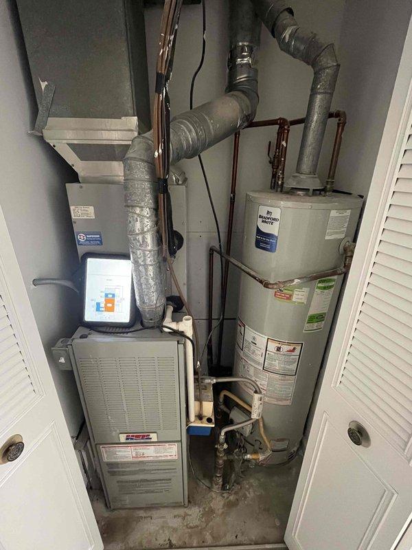 Conducted on-site assessment for complete air conditioning system replacement in residential property. Evaluated existing HVAC infrastructure including furnace unit located in utility closet with connected ductwork and return air vent system. Documented equipment specifications, measured return air grille dimensions, and photographed current installation configuration to provide accurate replacement estimate for new AC unit as requested.