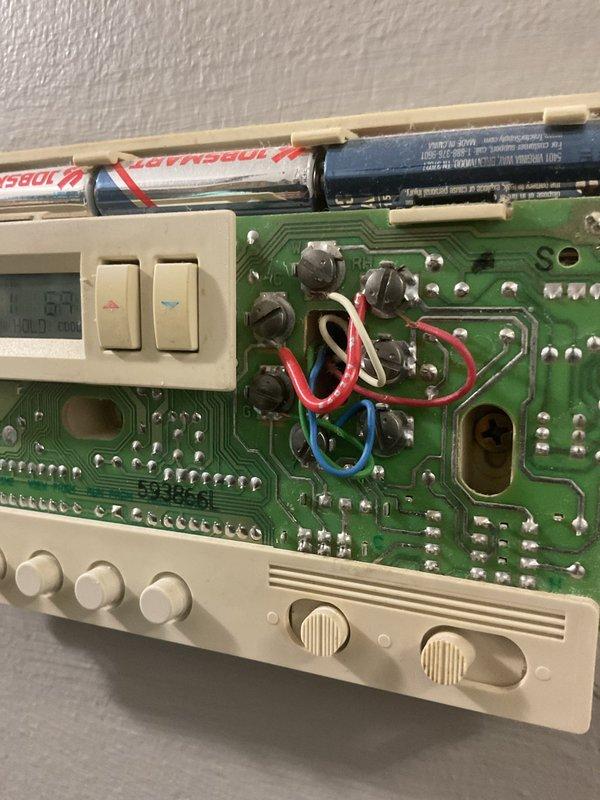 Conducted on-site consultation and assessment for complete air conditioning system replacement. Evaluated existing 19-year-old AC unit and documented current system configuration, including interior return air vent location and existing thermostat control system with exposed wiring and circuit board components. Provided homeowner with equipment options and financing information for new system installation.