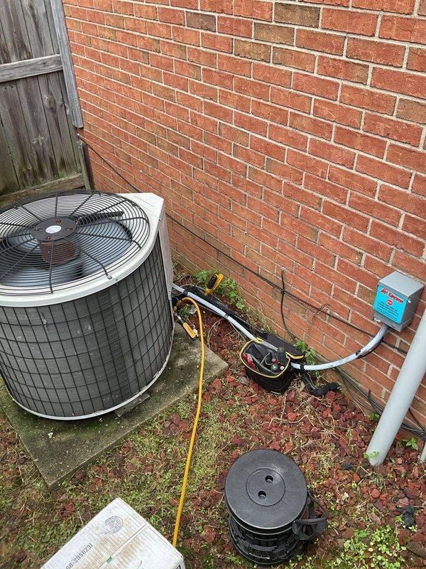 Responded to no-cooling call on 16-year-old heat pump system with tripped breaker. Upon arrival, confirmed breaker would immediately trip when reset, indicating electrical short. Diagnosed failed condenser fan motor causing overcurrent condition and breaker trip. Outdoor electrical disconnect box showed signs of overheating with burnt metal odor. Removed and replaced defective condenser fan motor assembly. Indoor evaporator coil exhibited heavy dirt accumulation, biological growth, and significant debris buildup affecting airflow and system efficiency. Cleaned evaporator coil thoroughly to restore proper heat transfer and airflow. Inspected all electrical connections at outdoor disconnect and condenser unit, finding evidence of heat damage at motor connections. Replaced damaged wiring and secured all electrical connections per manufacturer specifications. Reset breaker, tested system operation through complete cooling cycle. Verified proper amperage draw on new motor, adequate airflow 