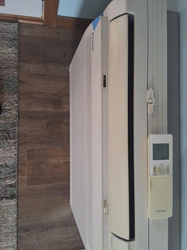 Responded to no-cool complaint on 8-year-old Daikin ductless mini-split system experiencing inadequate cooling performance with lukewarm air discharge and inability to maintain setpoint temperature. Performed diagnostic evaluation of wall-mounted indoor air handler and confirmed proper airflow, verified no refrigerant line restrictions or evaporator coil icing, and assessed system operation through remote controller interface. System operational with normal airflow distribution through louvers at time of service.