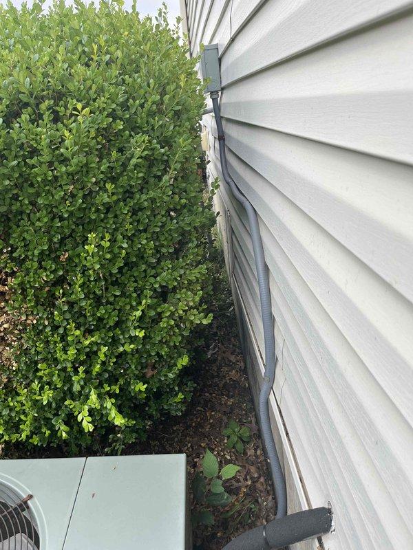 Conducted comprehensive HVAC system replacement estimate at residential property, evaluating existing furnace and mechanical equipment located in unfinished basement area. Assessed current system configuration including ductwork routing, electrical connections, and clearance requirements for replacement equipment. Documented exterior condensing unit location adjacent to foundation with considerations for proper clearances from landscaping and adequate ventilation access for new installation.