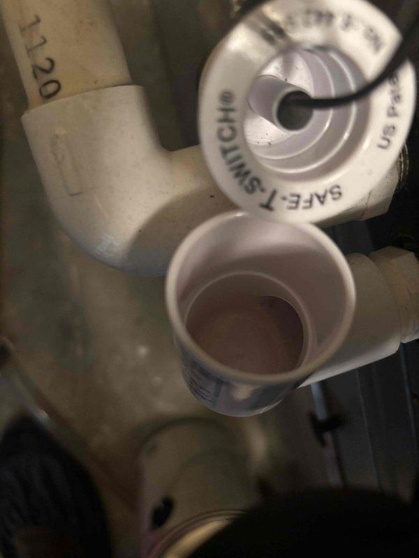 Responded to no cooling call on 14-year-old residential HVAC system. Upon arrival, verified thermostat operation and system status. Inspected condensate drain system and confirmed Safe-T-Switch secondary drain pan overflow safety device was properly installed and functioning. Performed diagnostic evaluation to identify cause of cooling failure and documented system condition with photos for service records.