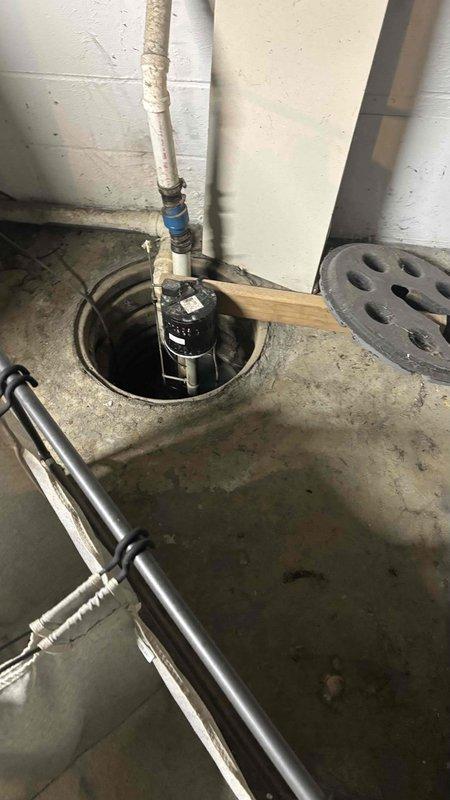 Conducted comprehensive assessment of residential HVAC system in basement utility area for cooling system replacement estimate. Upon inspection, evaluated existing furnace unit and ductwork configuration, documented current equipment condition and surrounding infrastructure including sump pump system and utility connections. Provided detailed replacement recommendations and system specifications for failed air conditioning unit.